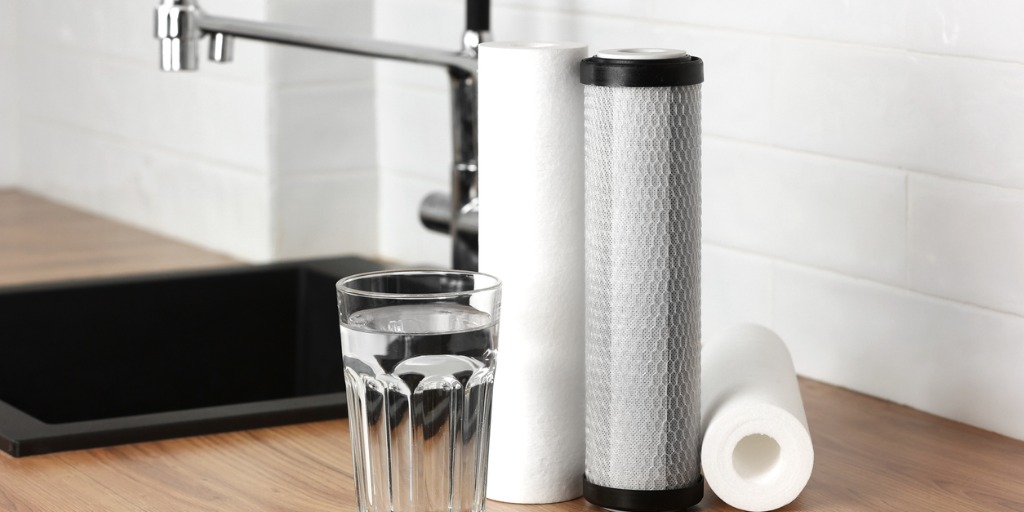 water filter and a glass of water