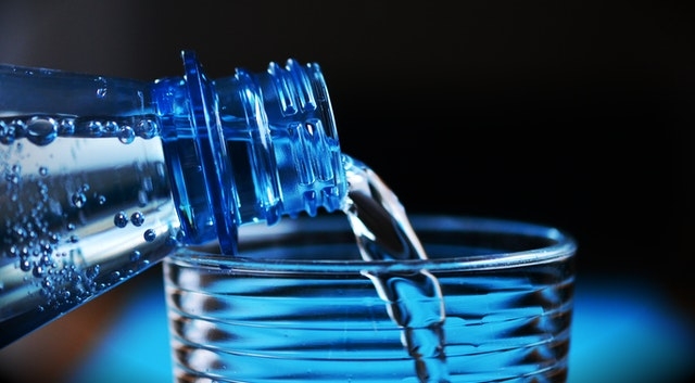 Close-up of bottle pouring water