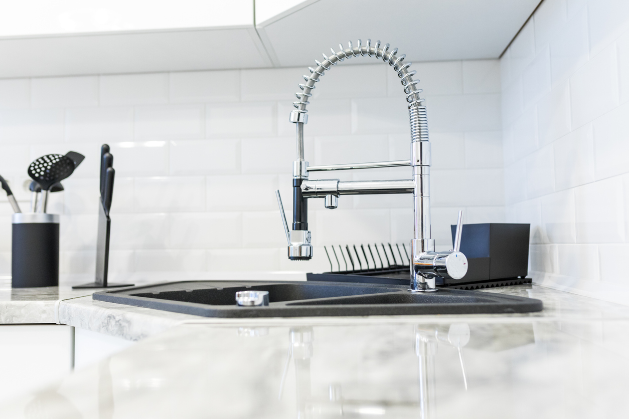 kitchen sink and a stylish faucet.
